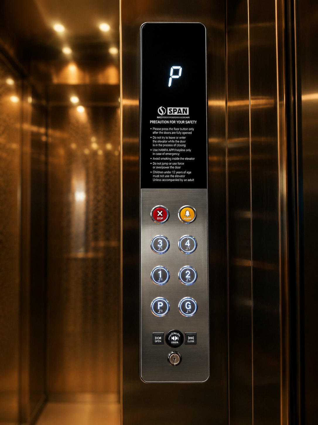 Span Command Panel — Span Ārohaṇa LX home cabin, Round back-lit keys, Braille, on black glass.